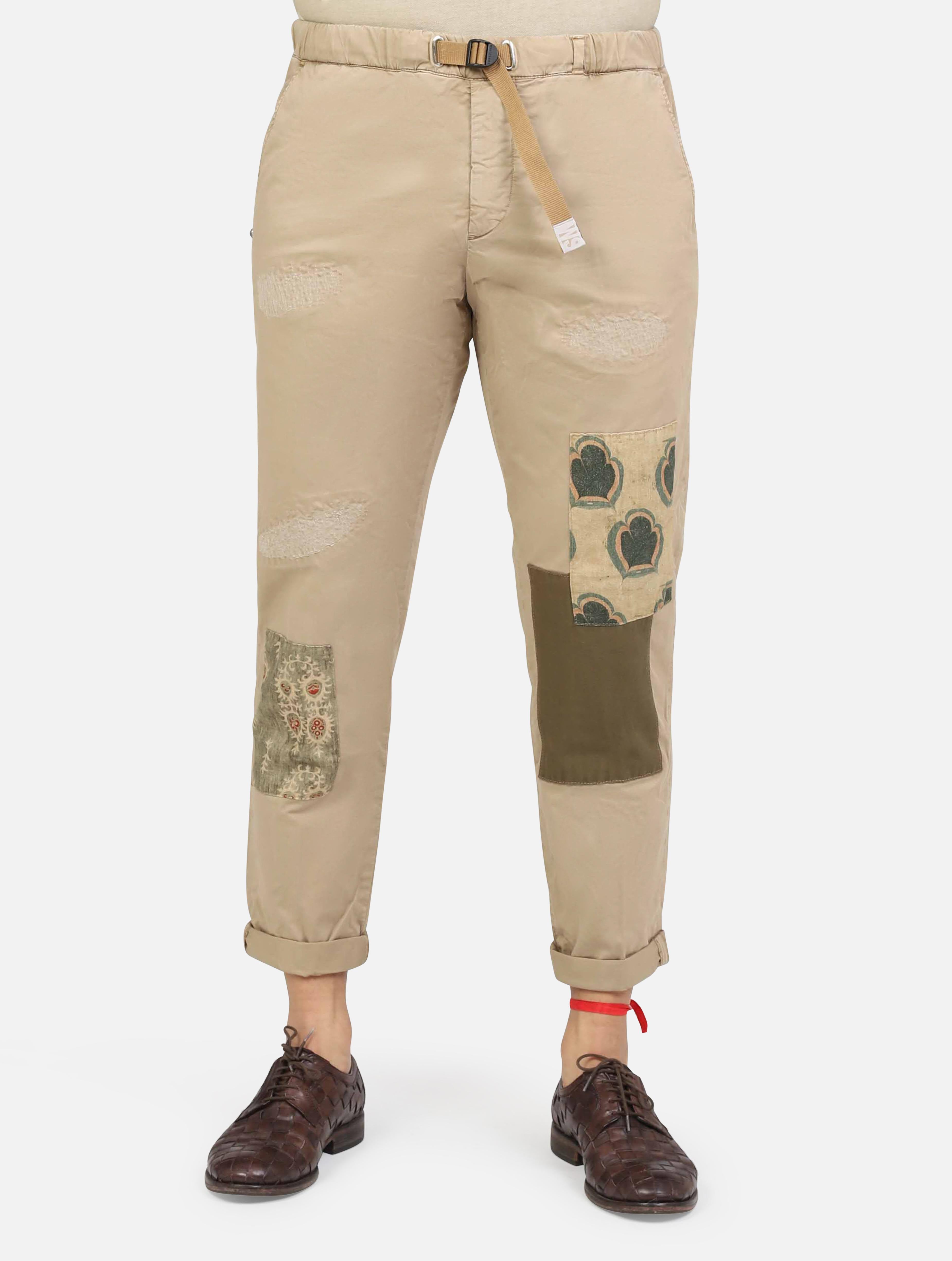 art. 25su66 83-l5: pantalaccio con tasche a taglio, vestibilità morbida; rotture ed abrasioni