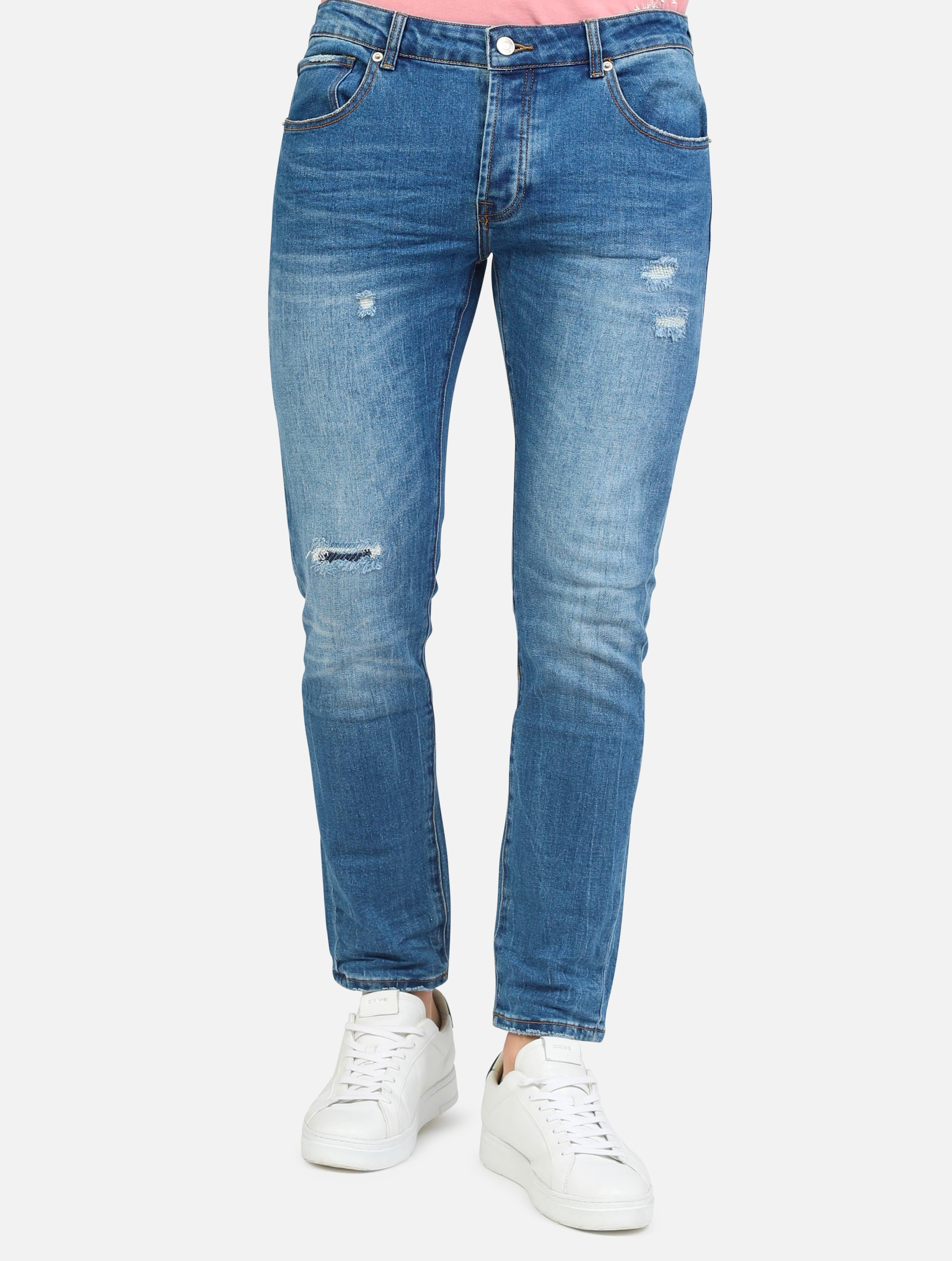 art. 1025: jeans con strappi, abrasioni e tasche taglio vivo