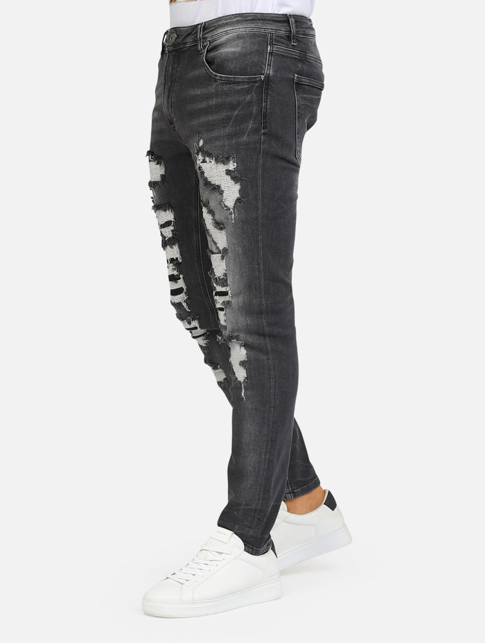 jeans kevin skinny fit con strappi e cuciture