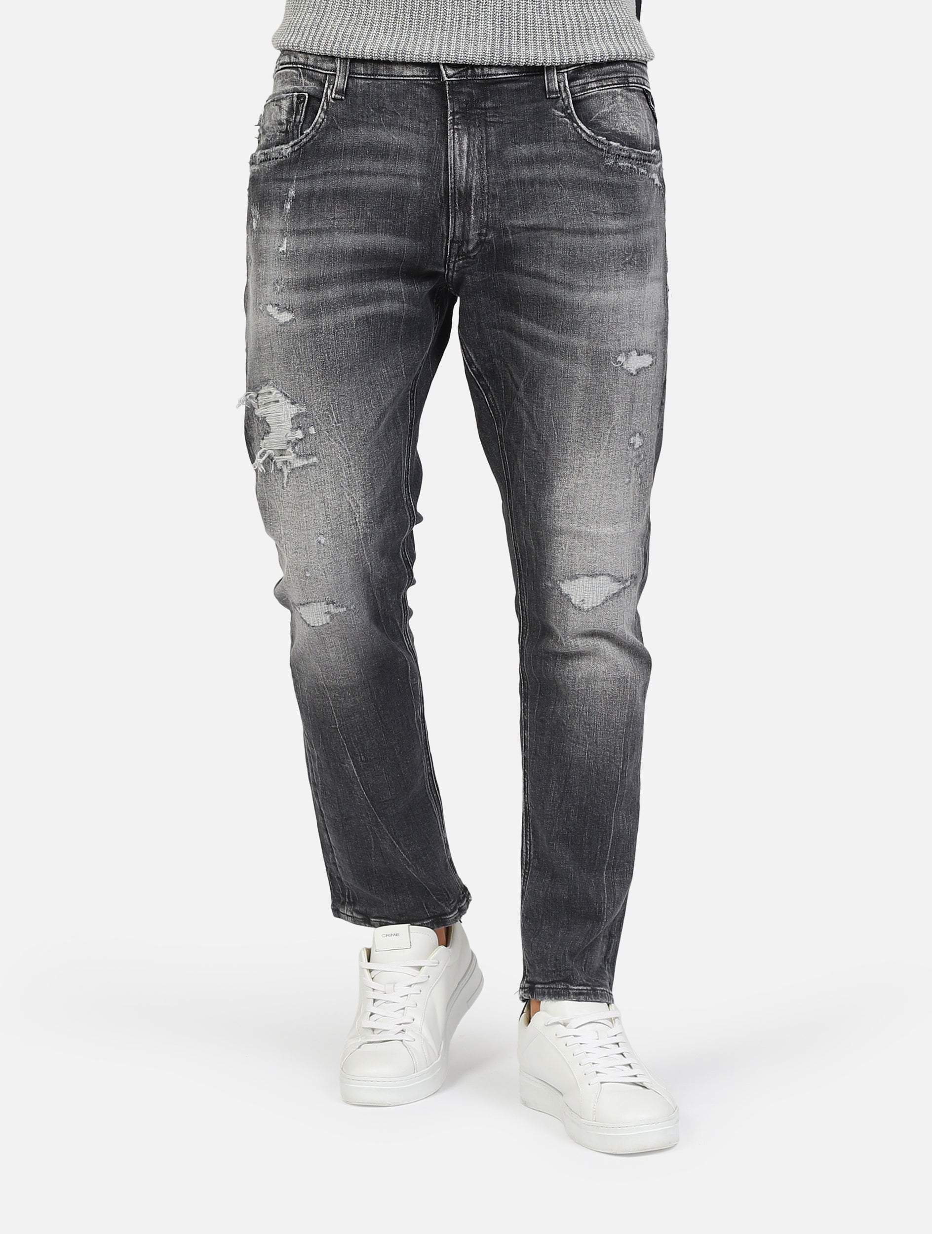 jeans nero con rottura slim tapered fit