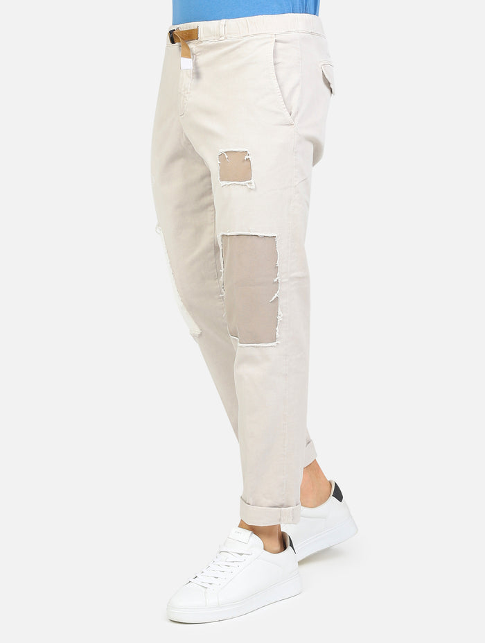 pantalaccio lungo tasche a taglio con toppe, cuciture e rotture