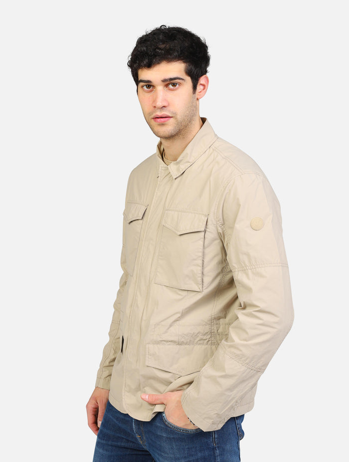 art. d32131m: giubbotto impermeabile in tessuto reciclabile con quattro tasche e chiusura zip