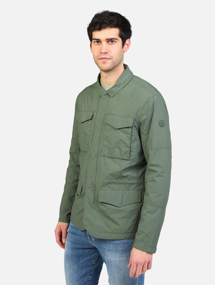 art. d32131m: giubbotto impermeabile in tessuto reciclabile con quattro tasche e chiusura zip